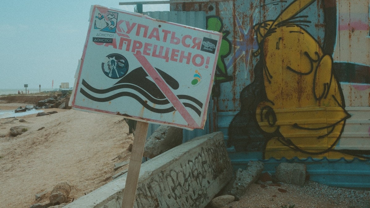 a sign on a beach
